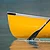 An energetic stroke sends a canoe gently down the stream.